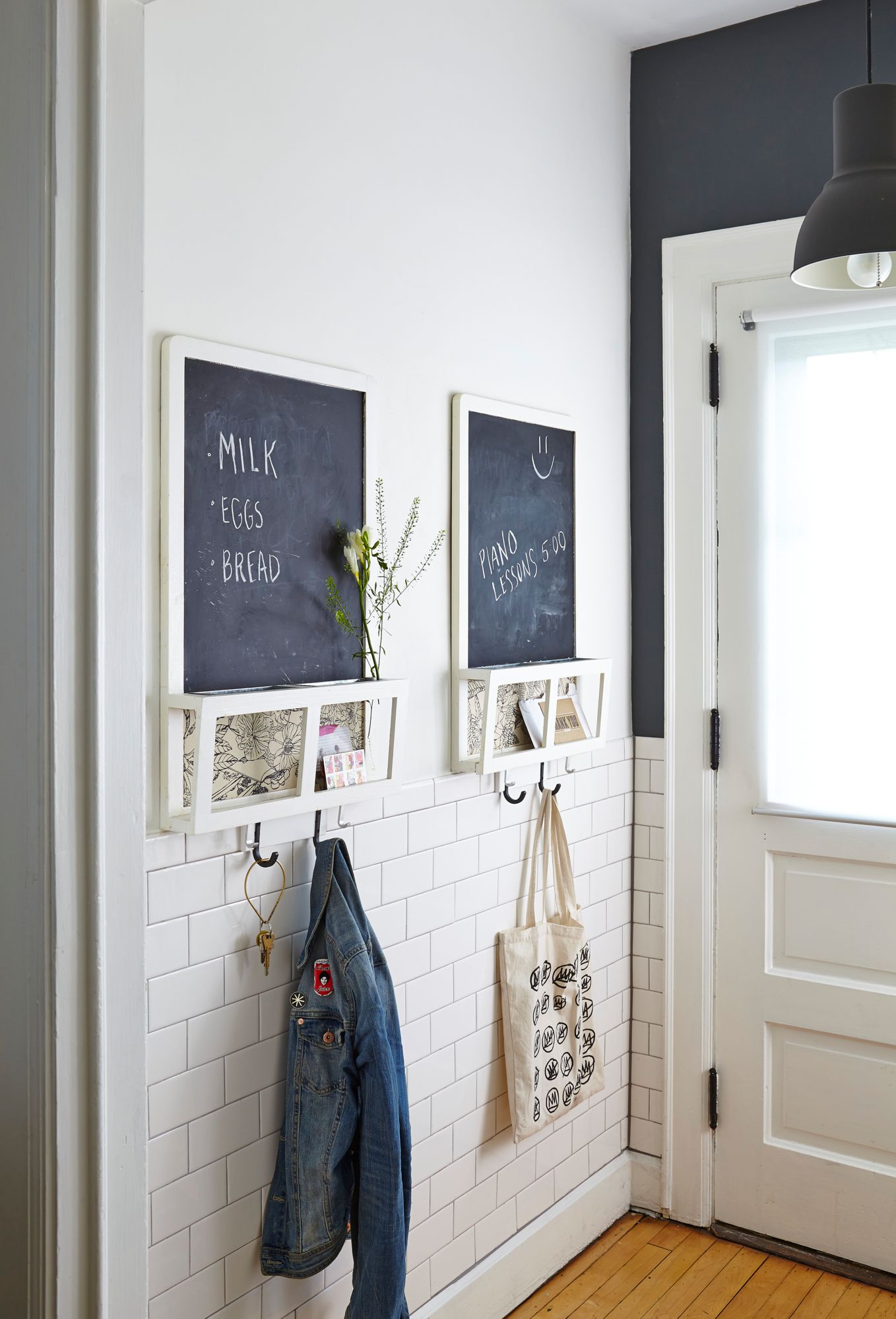 chalk boards and hooks by door