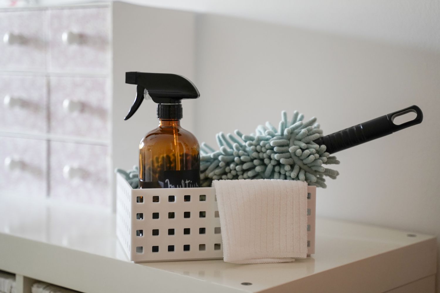 box of eco-friendly home cleaning supplies in white room