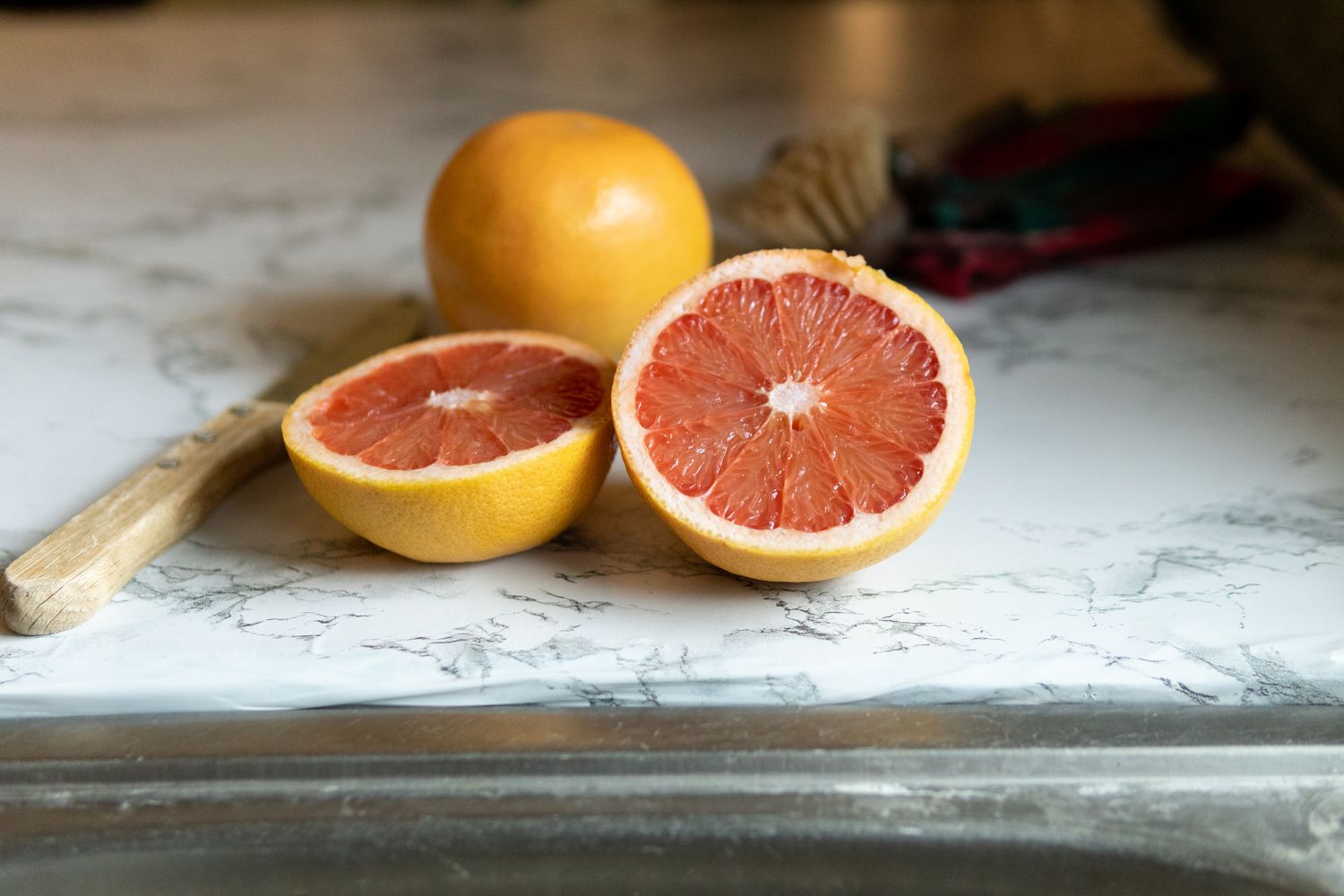 cut grapefruit on kitchen counter