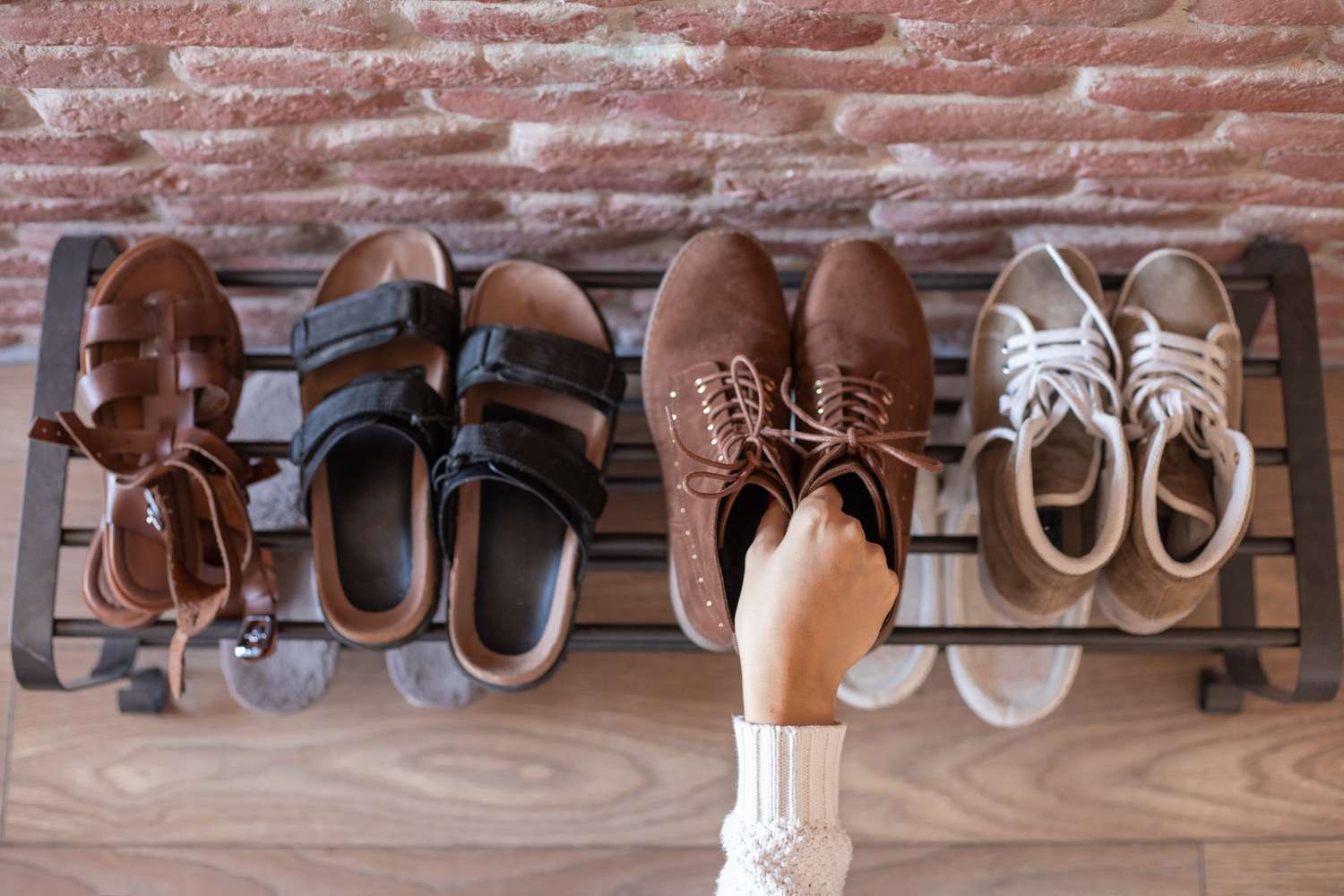 puts shoes on shoe rack